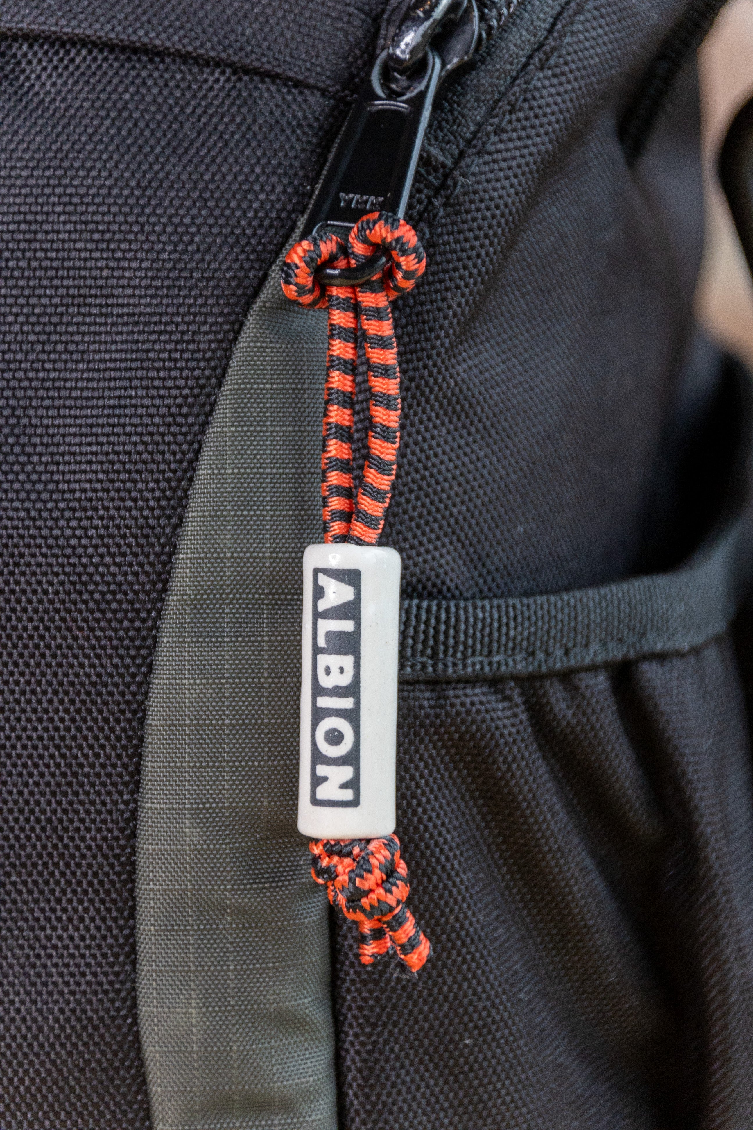 "Albion" Zipper Tag